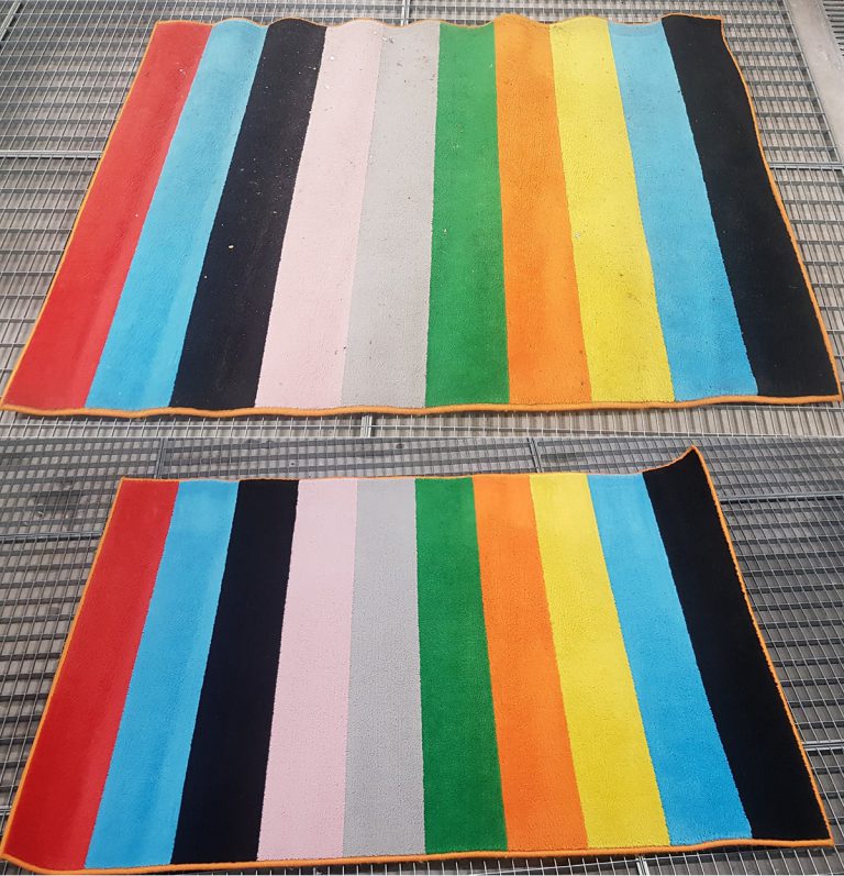 Kolorowy dywan po praniu z wyraźnymi kolorami po czyszczeniu w pralni Dywanik