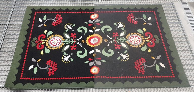 Dywan po praniu z wyraźnymi kolorami po czyszczeniu w automatycznej pralni Dywanik